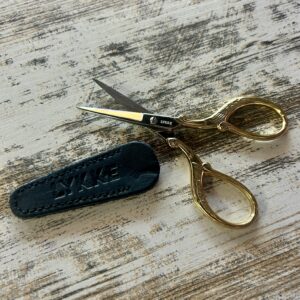 LYKKE scissors with 24K gold plating and leather sheath.