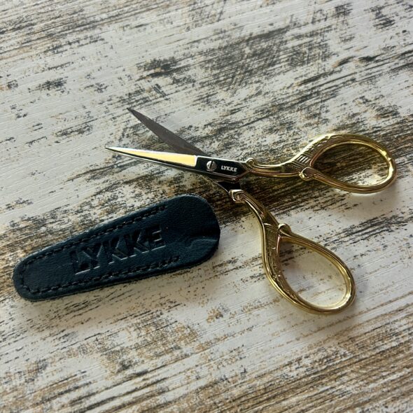LYKKE scissors with 24K gold plating and leather sheath.